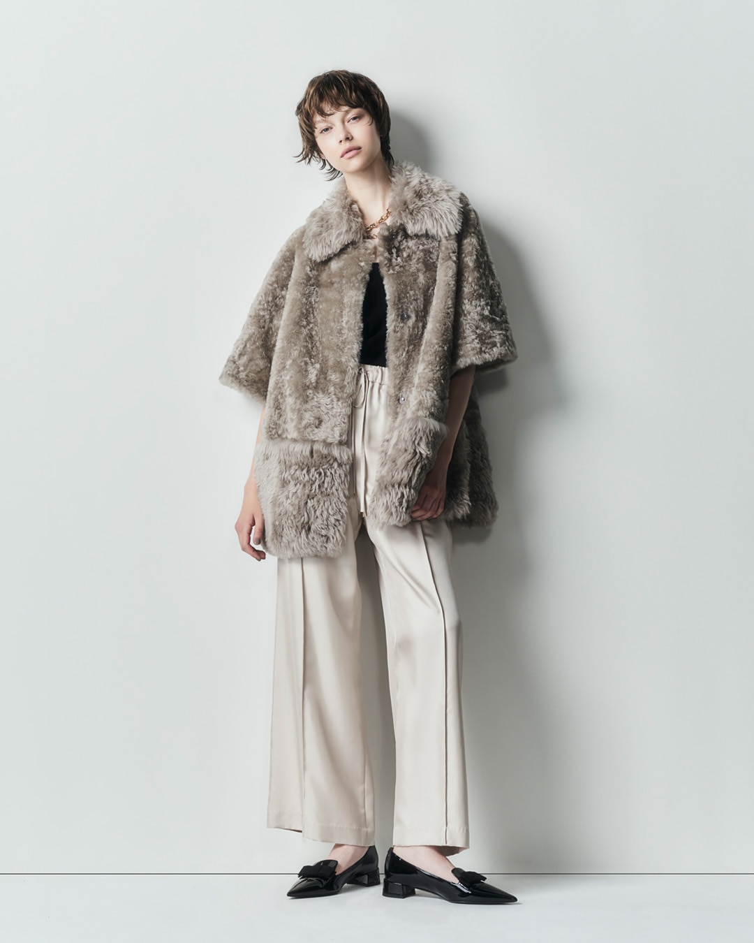 ムートンポンチョコート