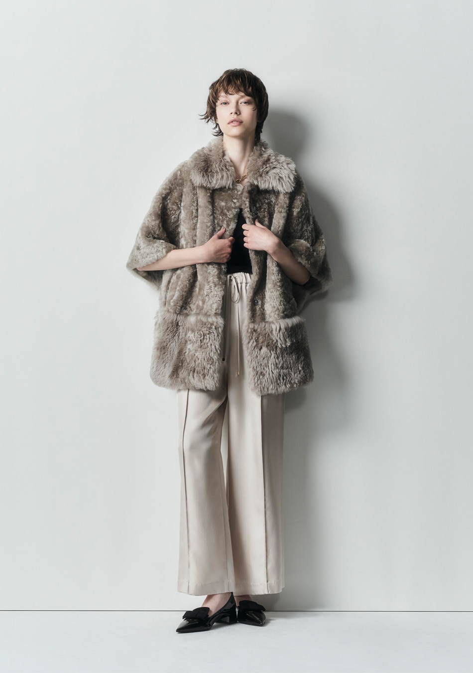 ムートンポンチョコート